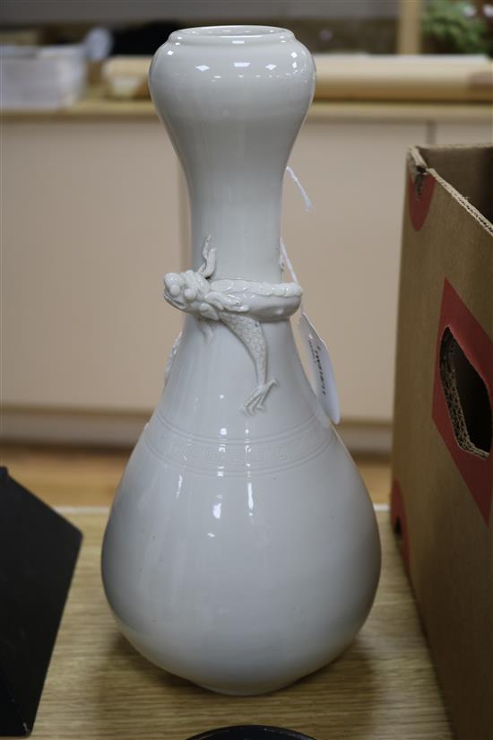 A Chinese Song-style blanc-de-chine dragon vase and a Japanese copper tray, H 30cm approx